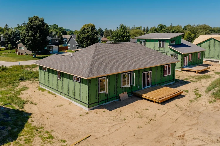 Rear corner of the home with wood deck