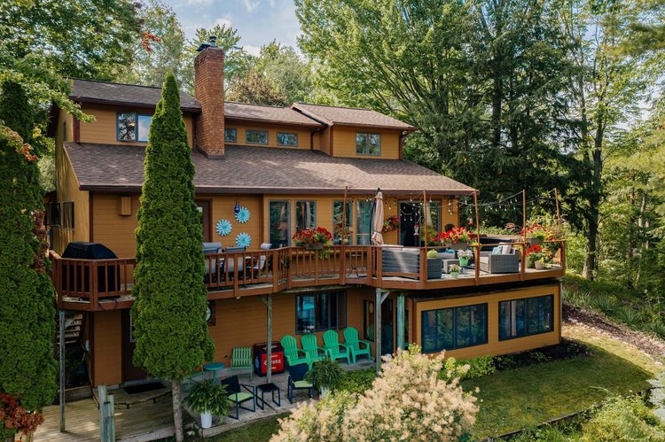 The lake side of the house with both decks
