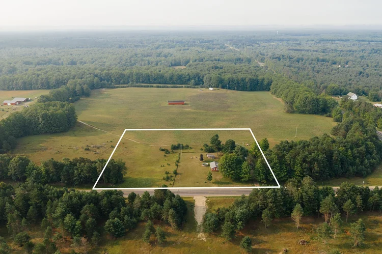 Aerial view with the property outlined in white