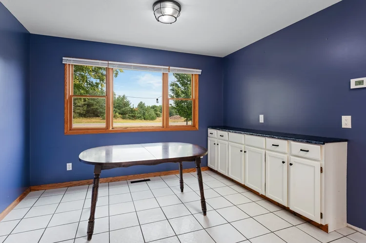 Dining area with window and built in cabinets