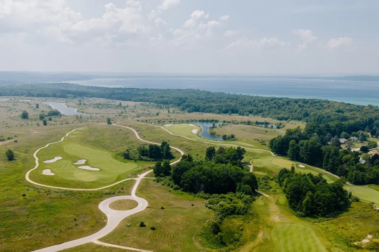 Aerial of a golf green and cart path loop
