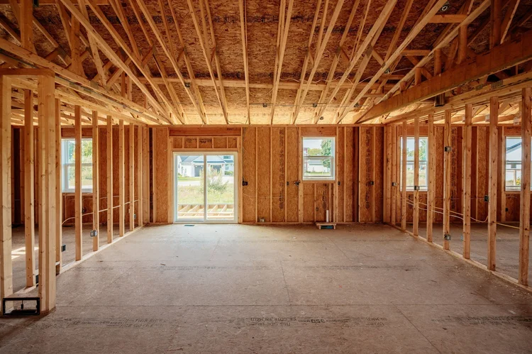 Framed main room facing the rear sliding door