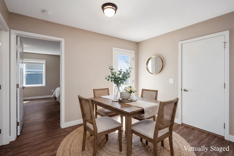Dining area beside the primary bedroom, virtually staged