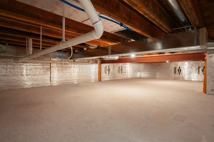 Crawl space with concrete floor and insulated walls