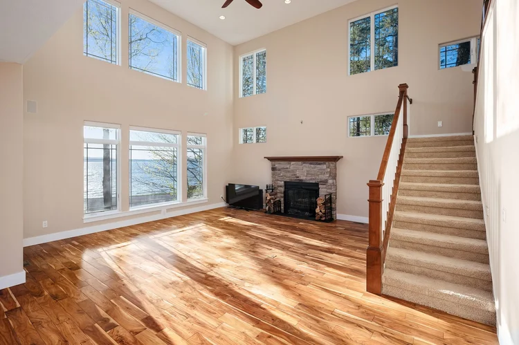 Two-story great room with stone fireplace