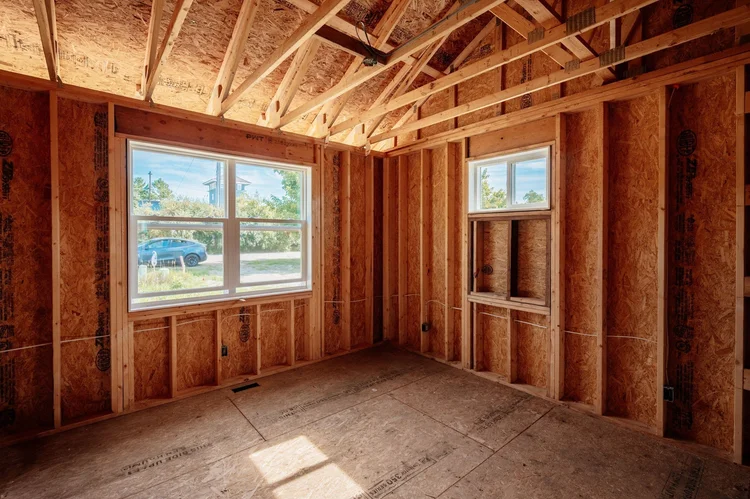 Framed corner room with two windows