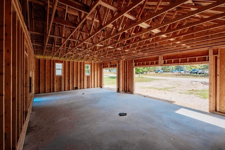 Garage interior with concrete floor and open door