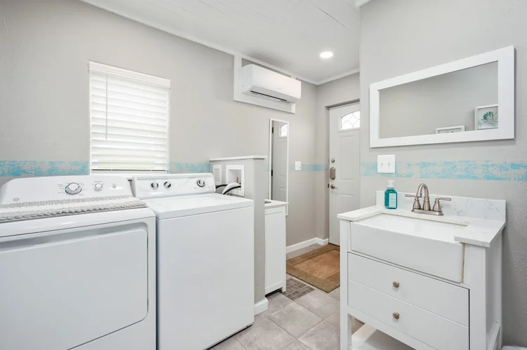 Bath house with vanity, washer and dryer