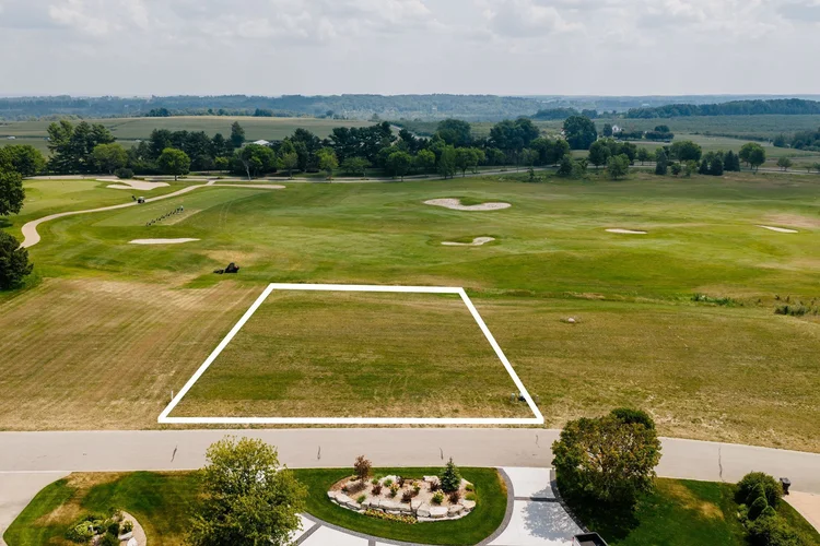 Outlined lot seen from the street toward the golf course