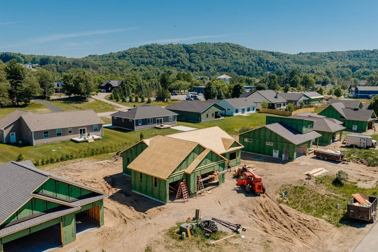 Aerial view of the home with the hills behind