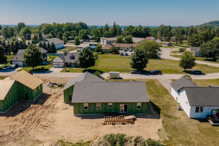 Aerial view of the back of the home and neighbors