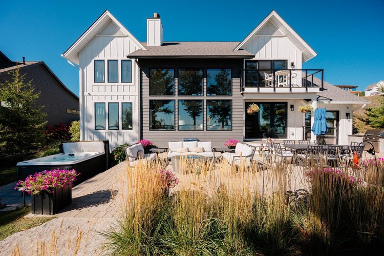 Bay side of the house with patio and grasses