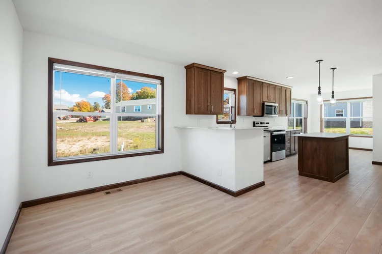 Kitchen and living area with large window