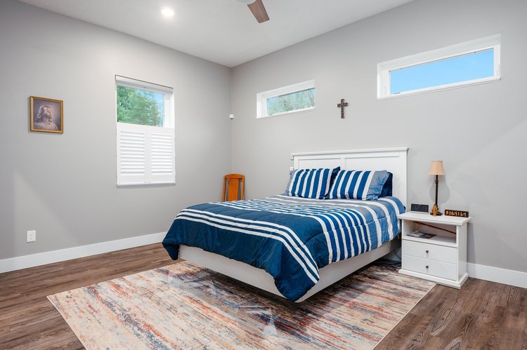 Primary bedroom with transom windows