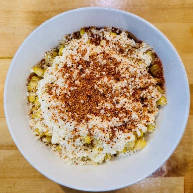 Elotes with rich creamy sauce, Cotija cheese and tangy seasoning