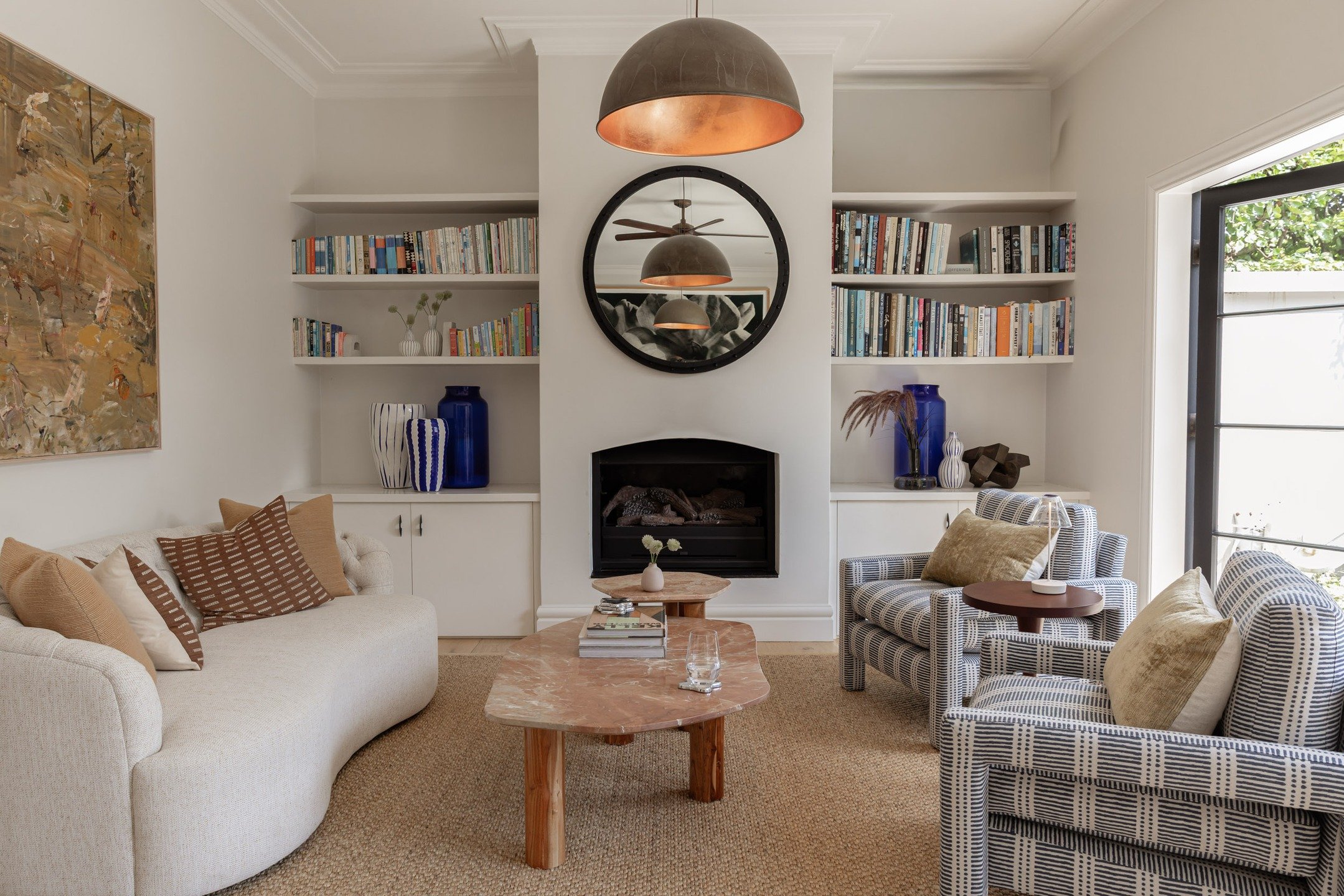 A measured calm defines each space, where light and texture take centre stage, and materials are allowed to reveal their depth. Shelves, surfaces and intimate corners quietly display the family&rsquo;s stories; photographs, books and collected object