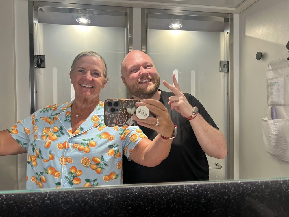 Jen and Cody sharing a smile in a mirror selfie