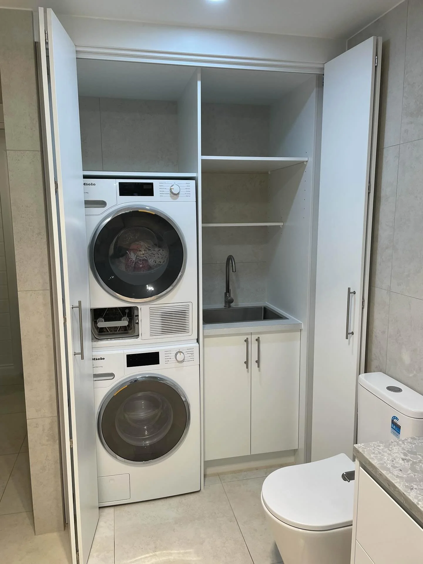 Our team has been diligently working on this project for a while, and it has required a significant amount of hands-on attention! 🔨🪚🔧 

The project involves renovating a bathroom/laundry combo, complete with a modern European-style laundry cupboar