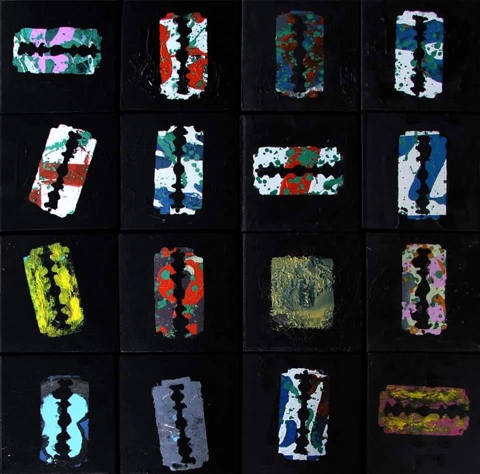 A grid of 16 colorful playing cards with various abstract patterns on a black background.