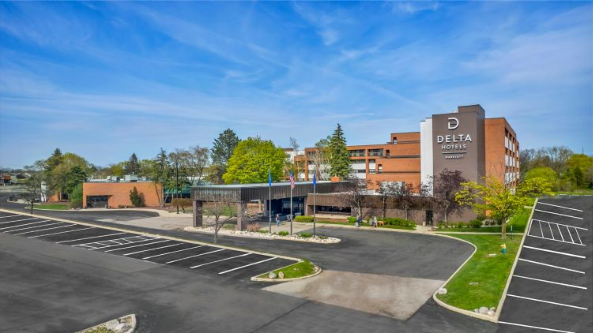 Hotel Exterior + Parking Lot