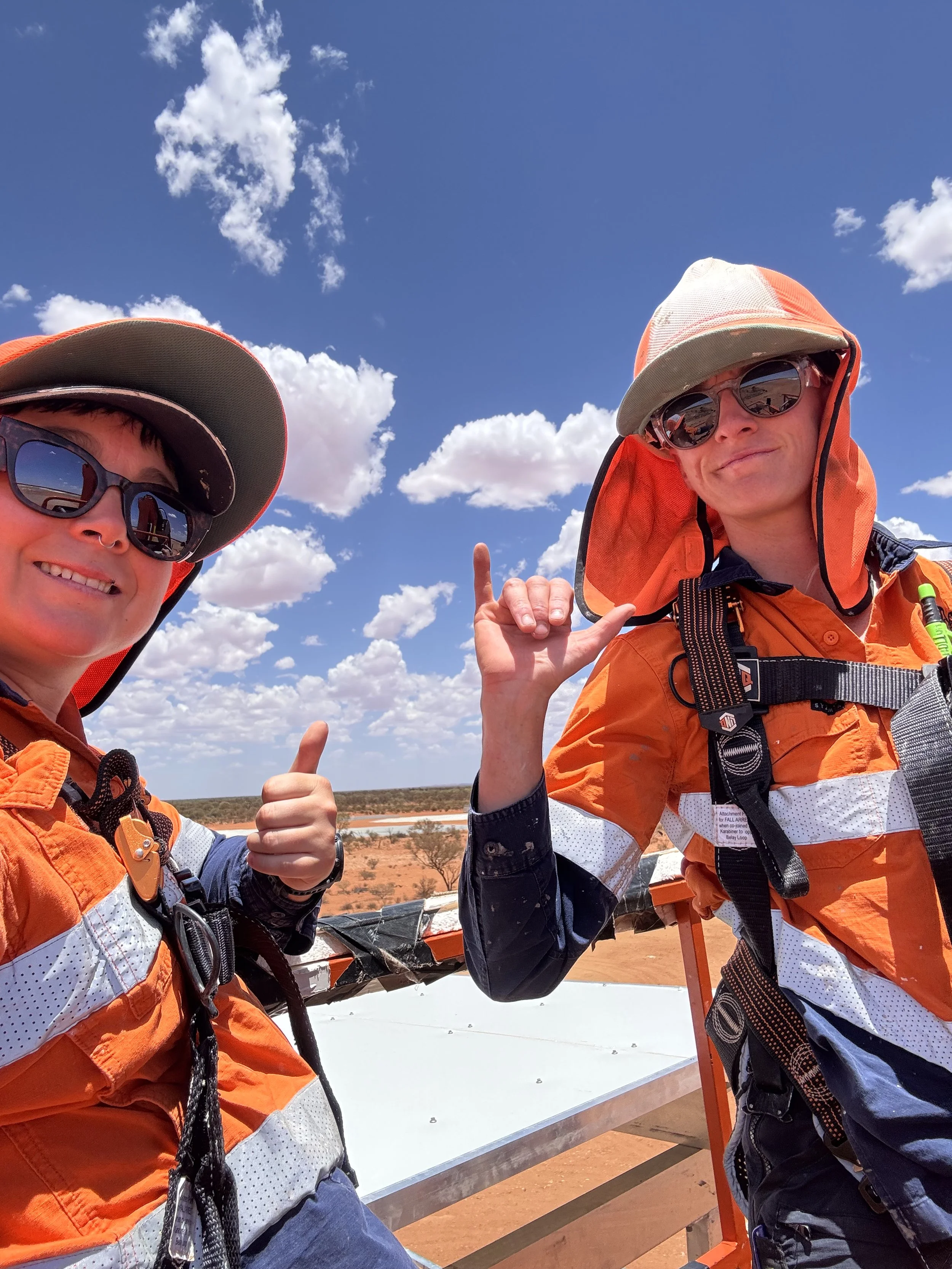 Hot chippies directors on site in remote Western Australia wearing high vis safety gear.