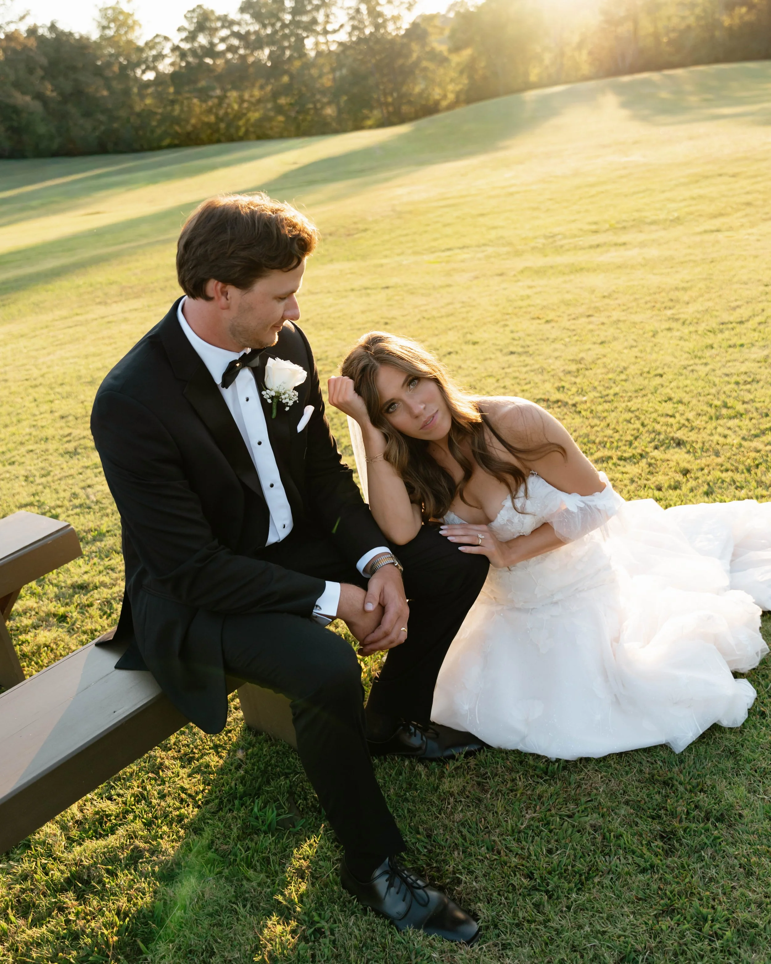 couple seated at their ceremony site for editorial couple's portraits