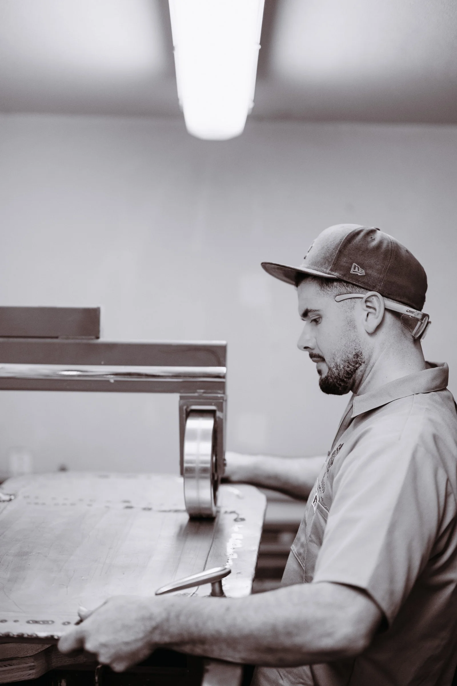 Lusso Vivo craftsman shaping sheet metal by hand in the Santa Barbara County workshop
