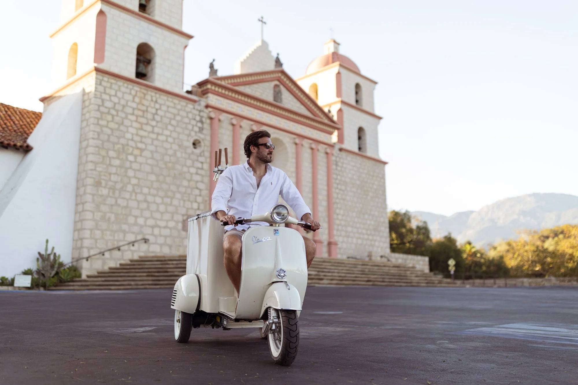 Vintage Vespa mobile bar with chrome taps outside the Santa Barbara Mission