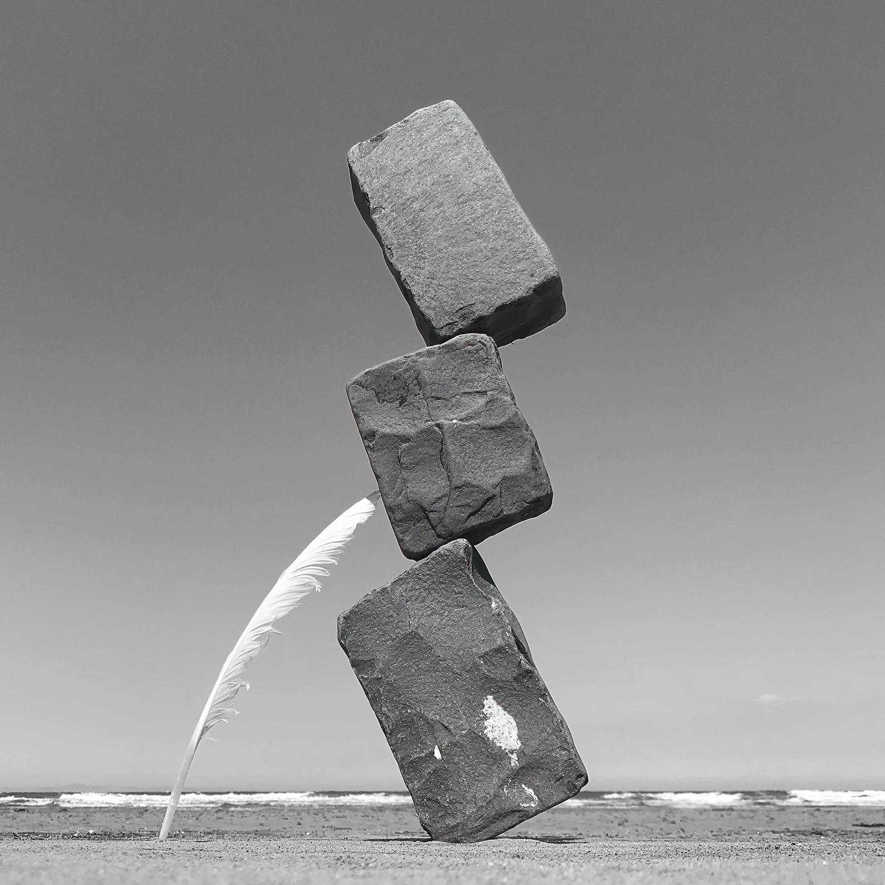 feather-stones-cobbles-balance-hold-leaning-mono-perspective-beach-simplicity-calmness-sculpture-paul-macphail-1800px-033.JPG