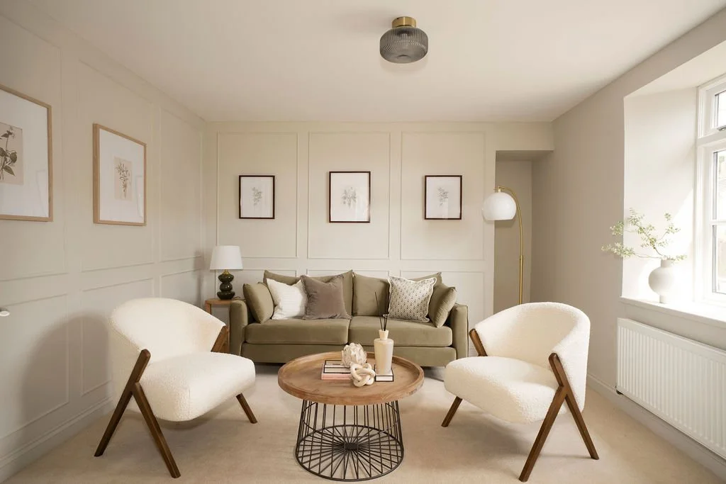 Professional home staging in Somerset by The Home Staging Specialists. This living room has been carefully staged with an olive green sofa, cream occasional chairs and warm neutral accessories to showcase the room’s proportions and create an inviting
