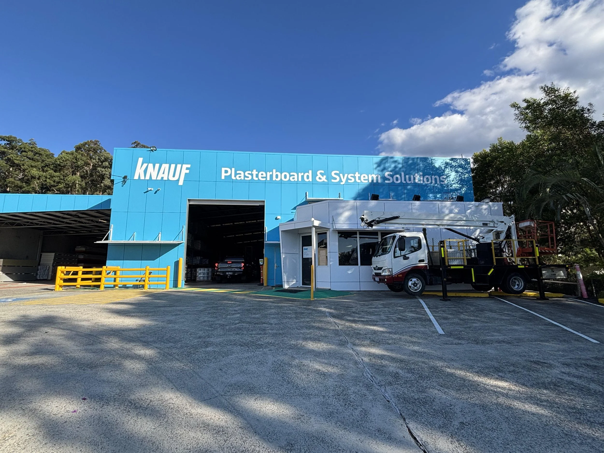 Cherry picker EWP for commercial building maintenance and signage installation at Knauf Plasterboard