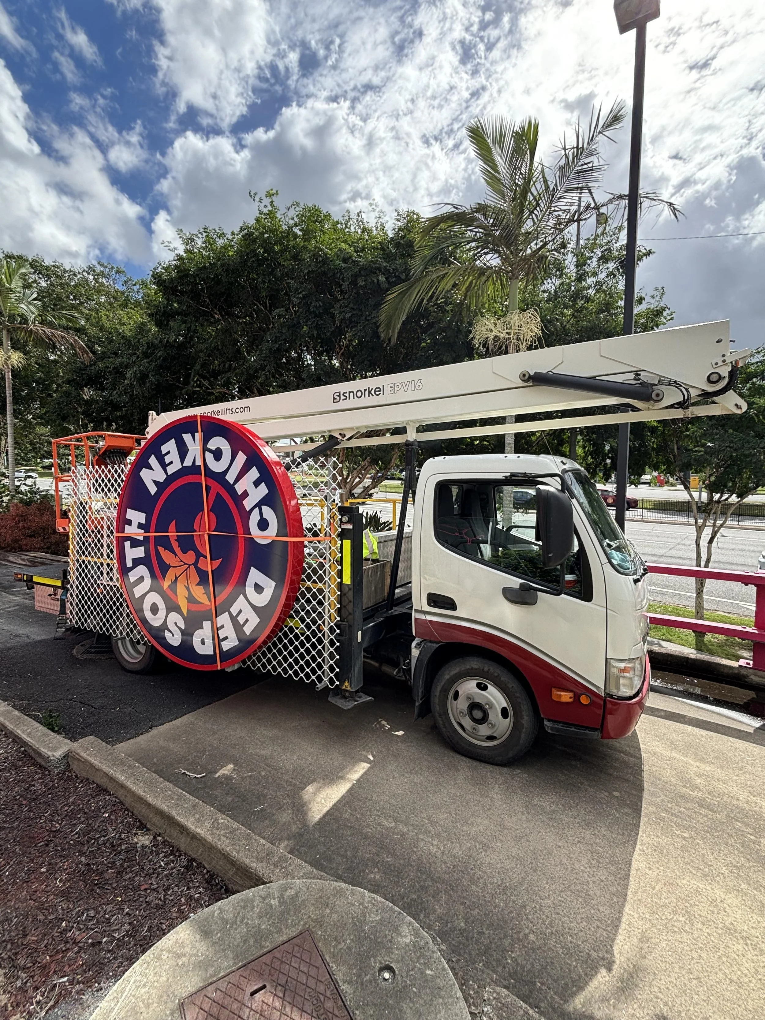 Cherry picker EWP Deep South Chicken sign, showcasing professional sign installation services across Gold Coast, Brisbane, and Byron Bay