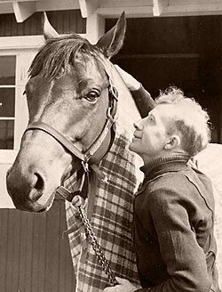 seabiscuit horse pictured with Red Pollard, the jockey who rode him through most of his career