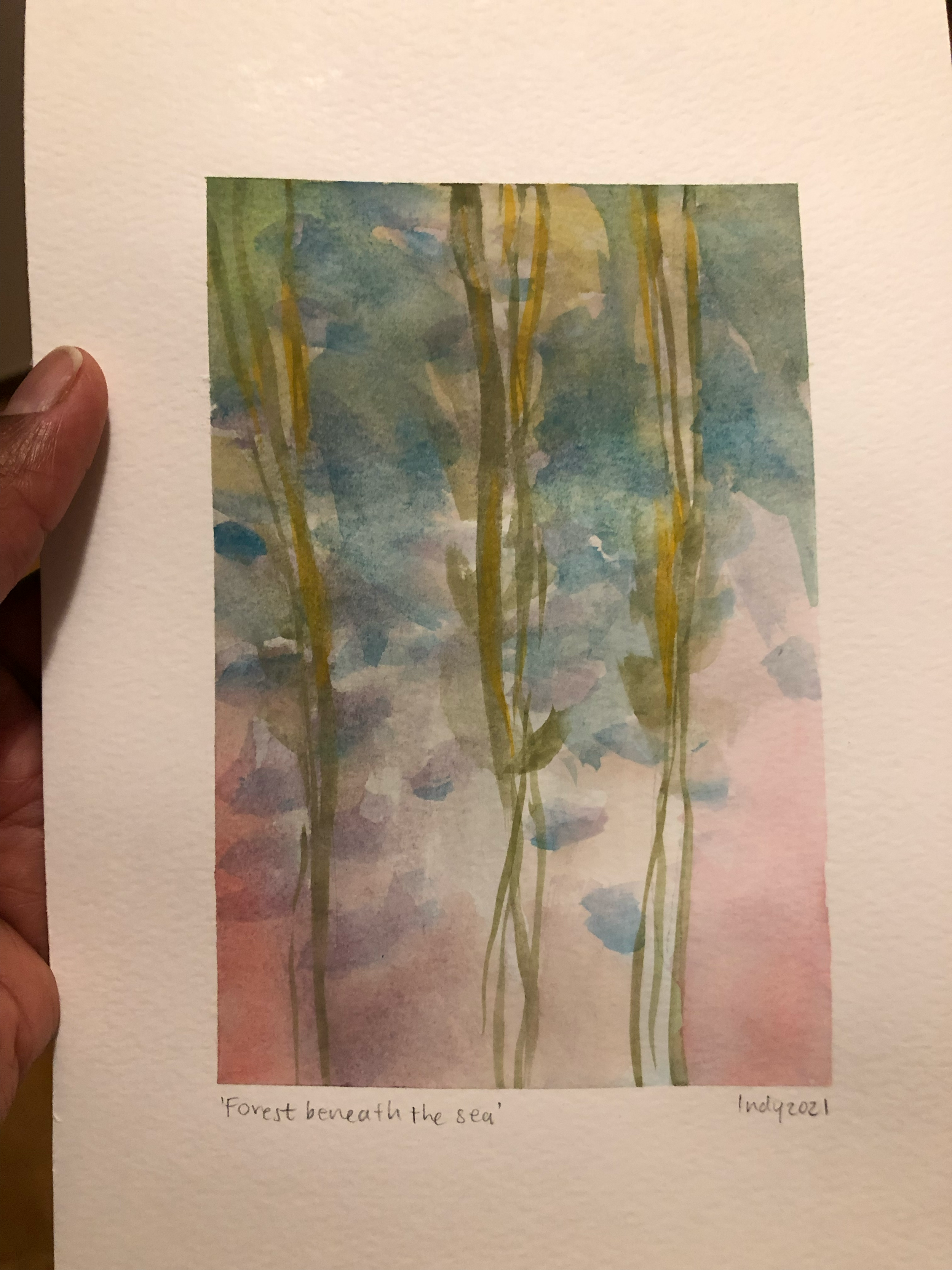 Watercolor painting titled 'Forest beneath the sea' depicting an abstract forest scene with green and blue tones, with hints of pink at the bottom.