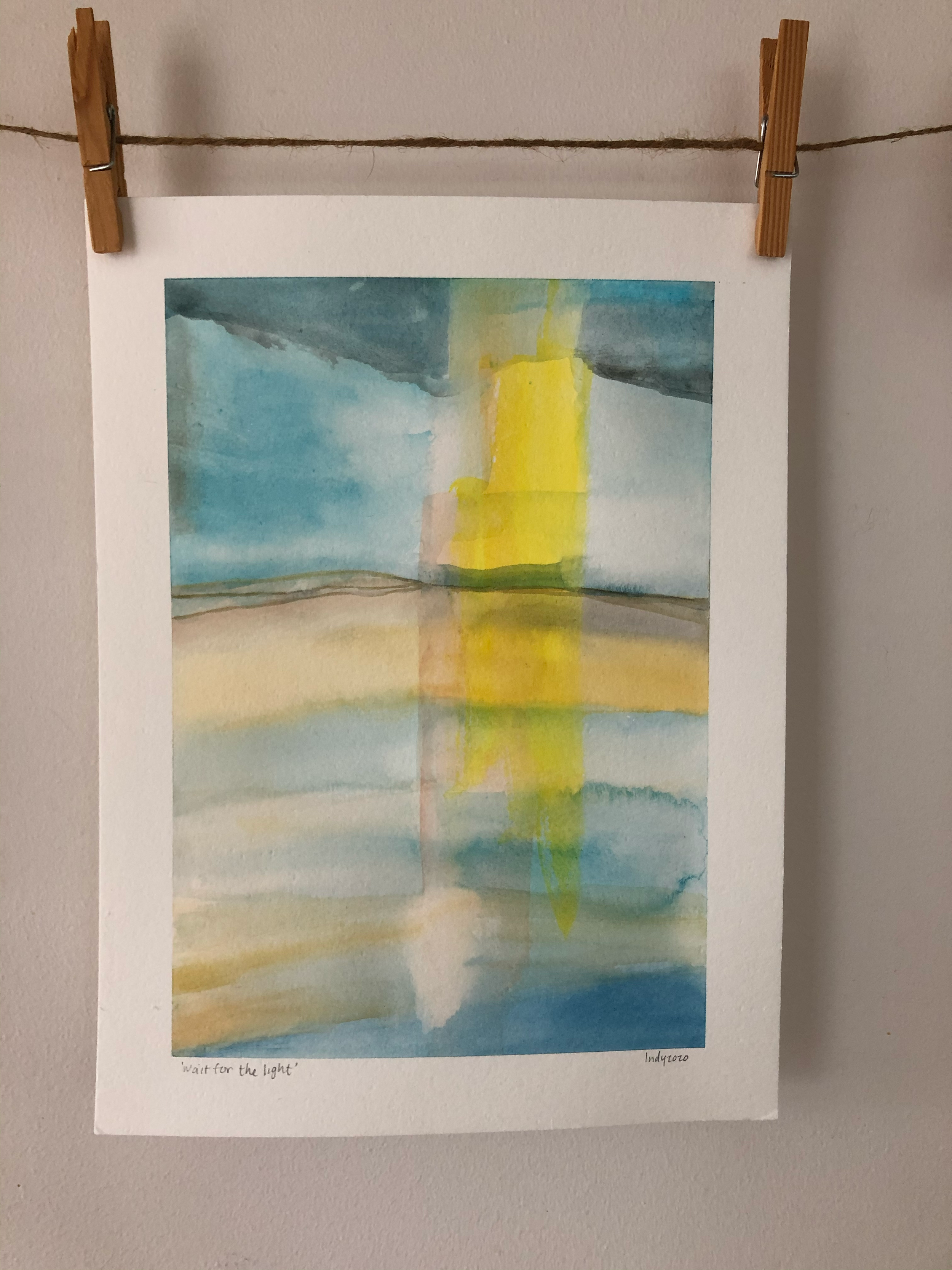 Watercolor painting depicting  light radiating down from the sky, reflected in water with a cloudy sky in the background.