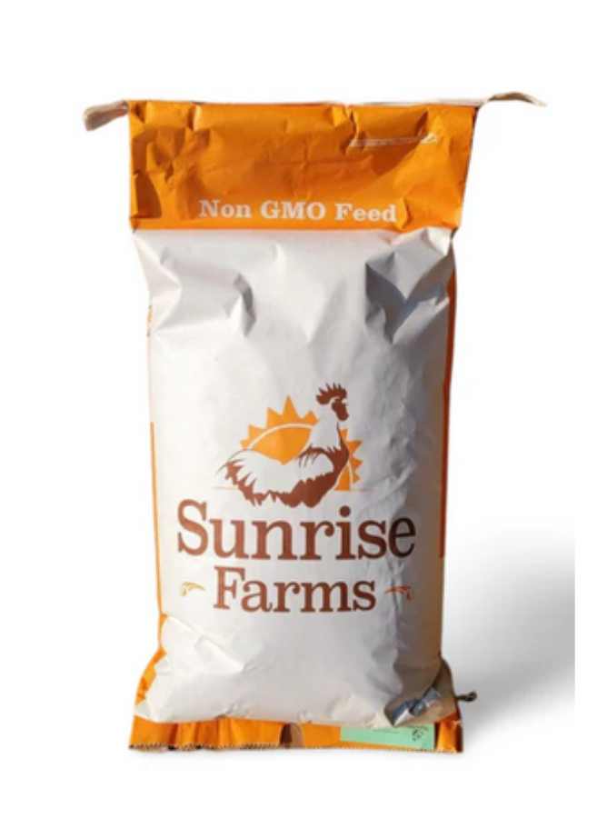 Bag of Sunrise Farms animal feed with non-GMO label and chicken logo.