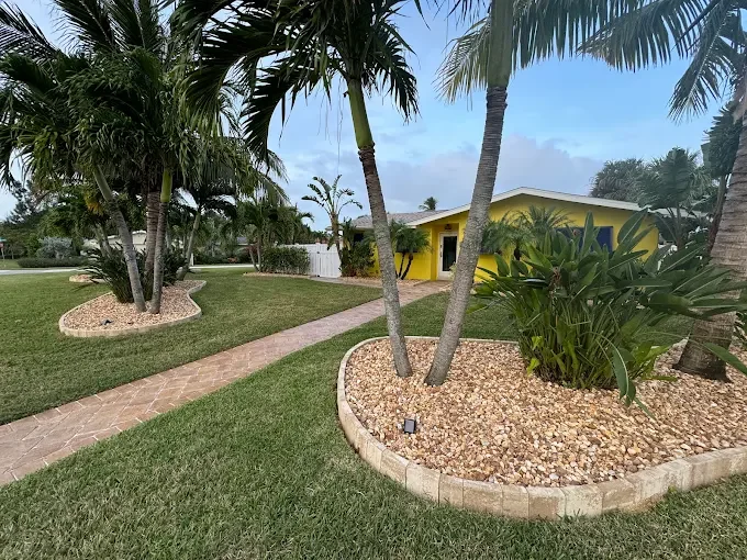Hardscape contractor serving Brevard County with custom paver driveways, pool decks, patios, walkways, retaining walls, seating walls, outdoor kitchens, fire pits, drainage systems, concrete work, and landscape enhancements.
