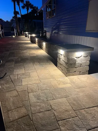 Hardscape contractor serving Brevard County with custom paver driveways, pool decks, patios, walkways, retaining walls, seating walls, outdoor kitchens, fire pits, drainage systems, concrete work, and landscape enhancements.