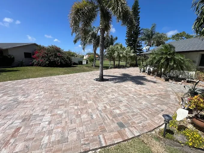 Hardscape contractor serving Brevard County with custom paver driveways, pool decks, patios, walkways, retaining walls, seating walls, outdoor kitchens, fire pits, drainage systems, concrete work, and landscape enhancements.