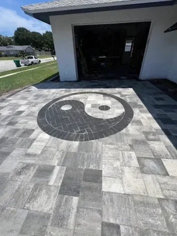 Hardscape contractor serving Brevard County with custom paver driveways, pool decks, patios, walkways, retaining walls, seating walls, outdoor kitchens, fire pits, drainage systems, concrete work, and landscape enhancements.