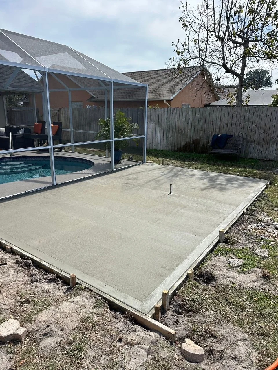 Outdoor living contractor serving Brevard County with paver driveways, patios, pool decks, retaining walls, artificial turf, concrete and drainage services.