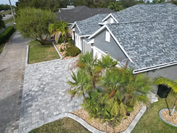 Hardscape contractor serving Brevard County with custom paver driveways, pool decks, patios, walkways, retaining walls, seating walls, outdoor kitchens, fire pits, drainage systems, concrete work, and landscape enhancements.