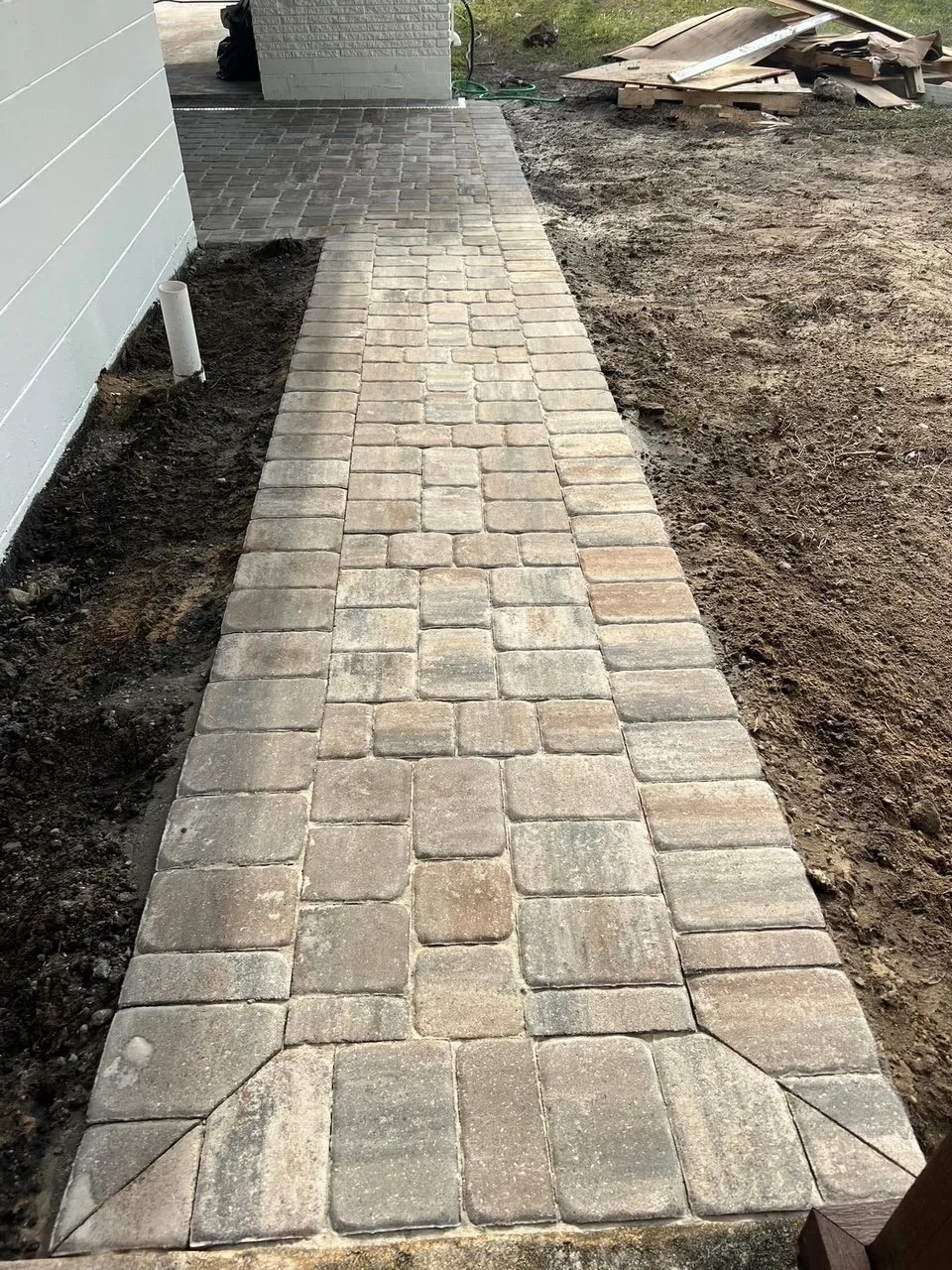 Residential hardscape contractor providing paver driveways, pool decks, patios, drainage solutions, and retaining wall installation throughout Melbourne, Viera, and Rockledge, Florida.