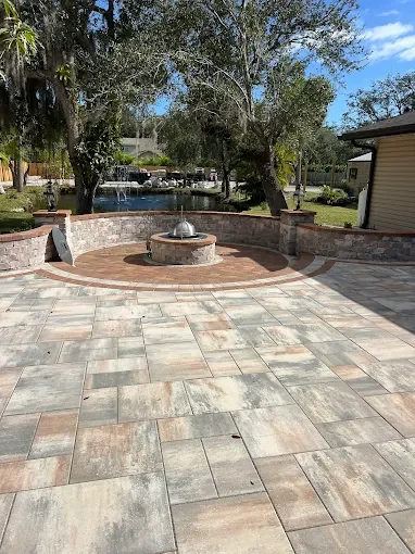 Hardscape contractor serving Brevard County with custom paver driveways, pool decks, patios, walkways, retaining walls, seating walls, outdoor kitchens, fire pits, drainage systems, concrete work, and landscape enhancements.