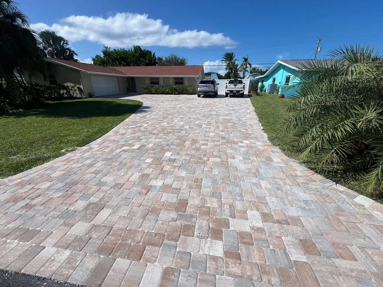 Hardscape contractor serving Brevard County with custom paver driveways, pool decks, patios, walkways, retaining walls, seating walls, outdoor kitchens, fire pits, drainage systems, concrete work, and landscape enhancements.