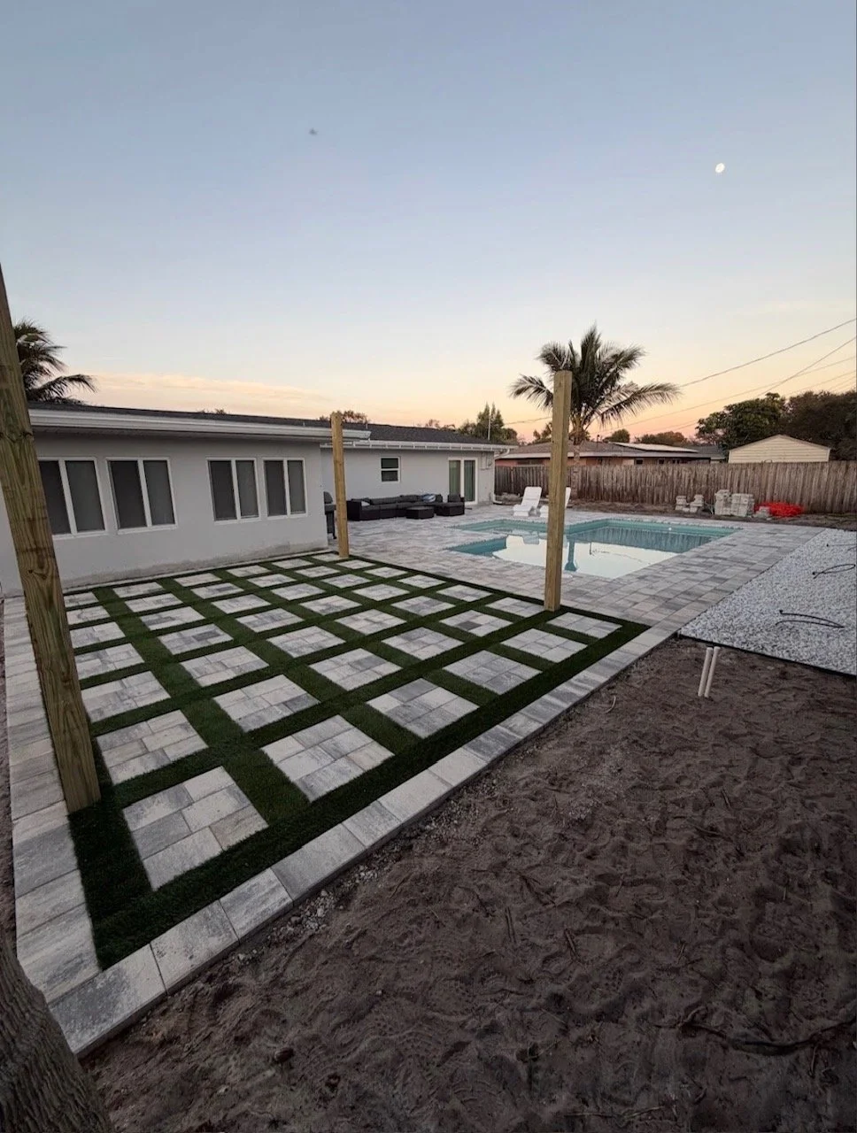 Hardscape contractor serving Brevard County with custom paver driveways, pool decks, patios, walkways, retaining walls, seating walls, outdoor kitchens, fire pits, drainage systems, concrete work, and landscape enhancements.