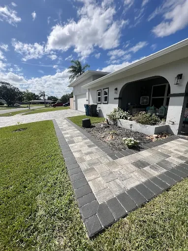 Hardscape contractor serving Brevard County with custom paver driveways, pool decks, patios, walkways, retaining walls, seating walls, outdoor kitchens, fire pits, drainage systems, concrete work, and landscape enhancements.