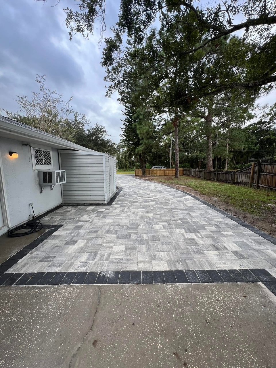 Professional paver installation contractor specializing in driveways, patios, walkways, retaining walls, outdoor kitchens, and fire pits throughout Brevard County, Florida.