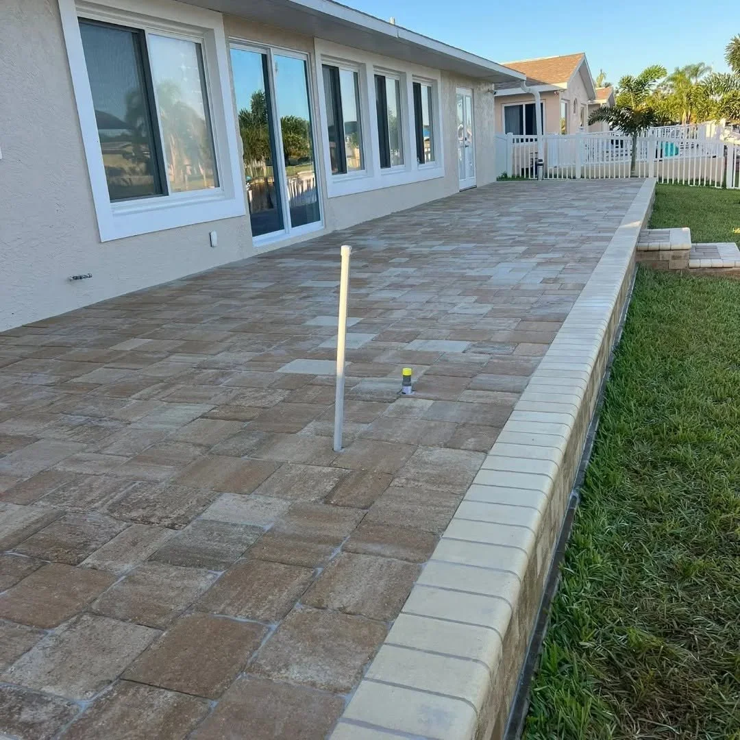 Custom outdoor living, paver installation, paver driveways, patios, pool decks, walkways, retaining walls, seating walls, outdoor kitchens, fire pits, concrete driveways, concrete patios, concrete walkways, drainage solutions, culvert installation