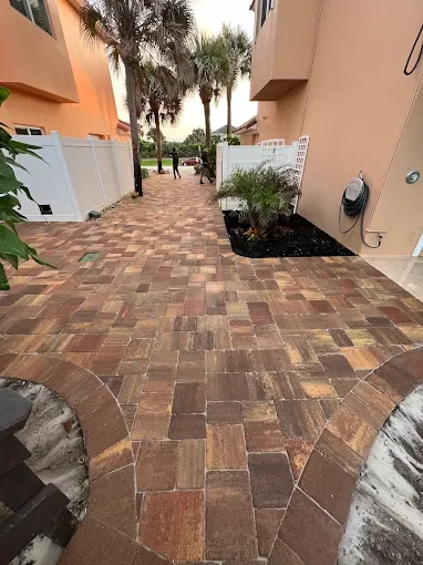 Custom outdoor renovation projects including pavers, concrete, drainage, retaining walls, and landscape improvements in Brevard County, Florida.